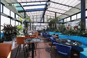 Rooftop restaurant seating at Xheko Imperial